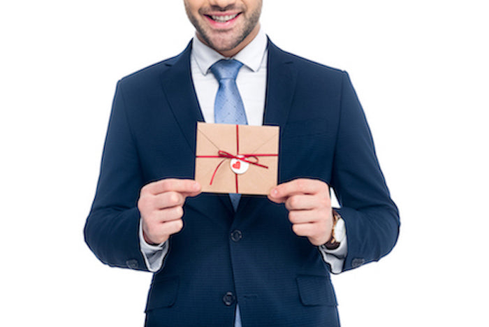 Real estate agent holding gift from buyer